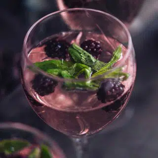 Blackberry ginger balsamic vinegar drink garnished with blackberries and mint