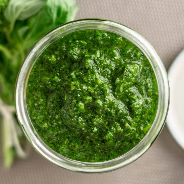 Glass jar full of spicy calabrian pesto