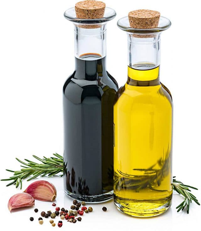 glass display bottles of balsamic vinegar and extra virgin olive oil
