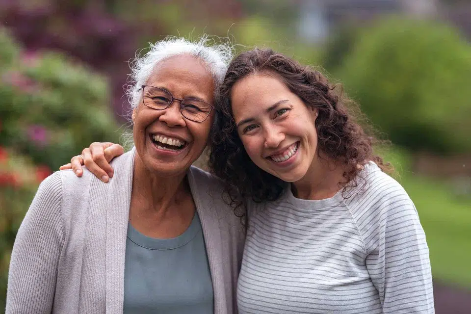 Two women smiling at the camera together