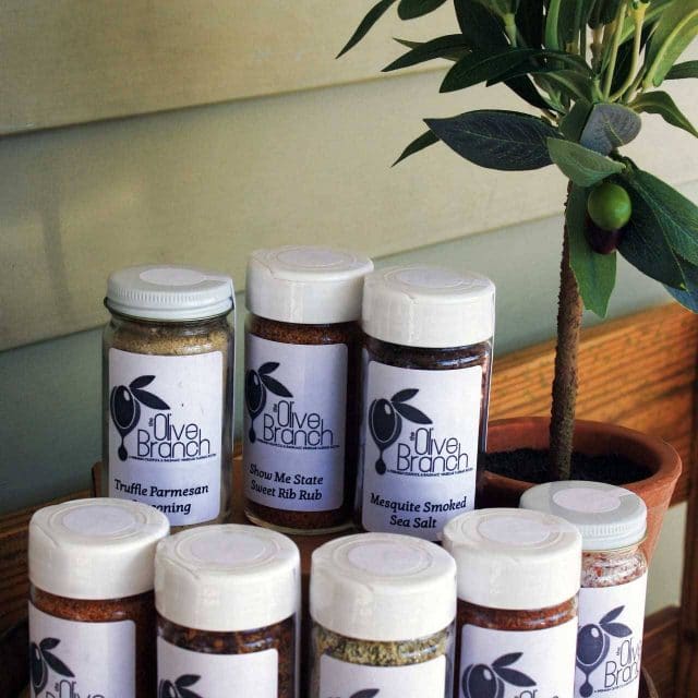 A variety of The Olive Branch bottled seasoning blends in glass jars