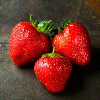 Three red strawberries
