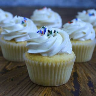 Vanilla cupcakes with white vanilla balsamic vinegar frosting and sprinkles